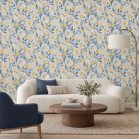 Salon avec canapé bouclé crème et papier peint floral bleu et blanc aux fleurs jaunes