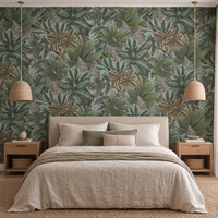 Papier peint feuilles tropicales vert sauge et gris bleuté dans une chambre