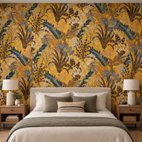 Papier peint feuillage tropical jaune ocre et bleu derrière une tête de lit en chambre