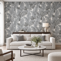 Papier peint grandes feuilles grises et blanches dans un salon, vue de face