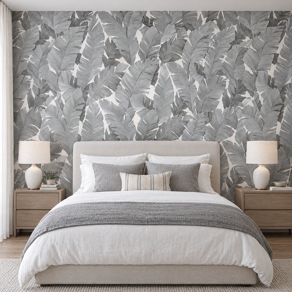 Papier peint grandes feuilles grises et blanches dans une chambre, tête de lit